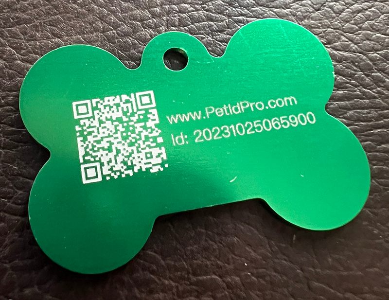 Back of the tag showing a QR code, PetIdPro.com, and a unique ID number